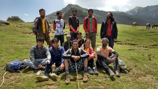 The runners who completed the 1200 to 3700 metres Khaliya Altitude Challenge (May 2018). Theo is on the extreme right sitting while the 3747 metre Khalia peak is just visible in the background.