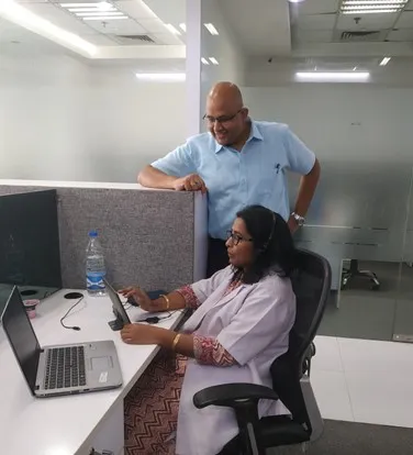 Interacting with a Doctor Colleague in NOIDA Office