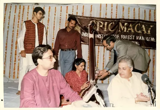 Supported what I believe was the first SPIC MACAY event at IIFM in 1996/97. Here in the photo are the then Director, IIFM, Mr Vinod Vaish of the then Ministry of Environment and Forests, GOI felicitating the Rajan and Sajan Mishra troupe, and my batchmate, Shakeb Nabi.