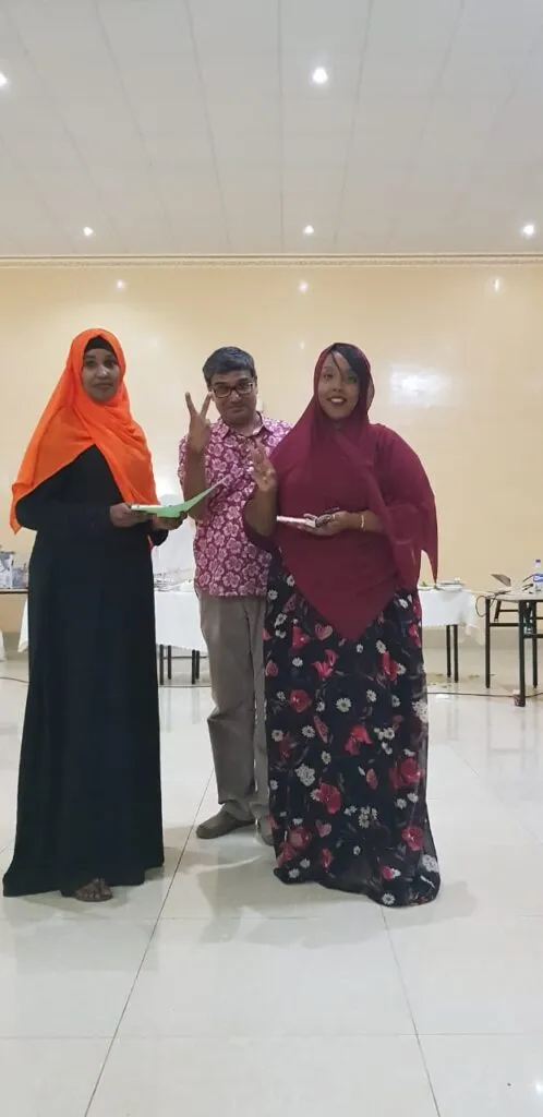Handing over certificate of excellence to a colleague in Hargeisa, Somaliland - 2017