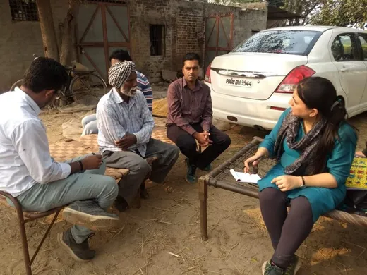 conducting interviews with farmers