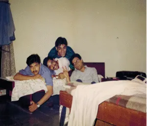 Fooling around with Sandy, Rajeev, and Chetan in my room. The music system on the table was stolen by some local kids a few days later along with Sandy’s ‘luxury towel’!