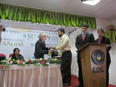 Receiving the Best Paper Award at SusCon-III, IIM Shillong, 2013