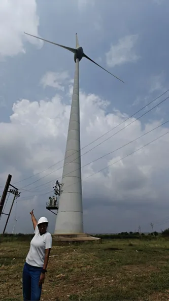 Shirin with a windmill in background: Being a part of India’s Renewable Energy Journey