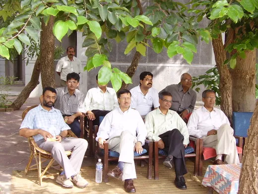 IIFM Faculty watching volleyball near the MDP hostel