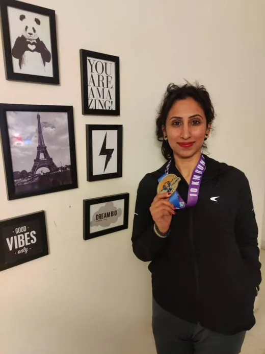 Rajani after winning a gold medal for running 43 attempts of 10k in 2021
