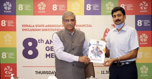 Releasing the Annual Report of the Kerala MFI Association with our President, Shri Paul Thomas