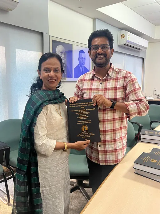 With my supervisor while making the PhD thesis submission at TISS Mumbai