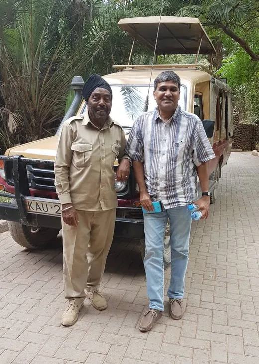 With Kartar Singh of Amboseli, Kenya who has climbed Mount Kilimanjaro many times. His father traveled to Kenya and married a Kenyan woman and settled down in the foothills of Mount Kilimanjaro.